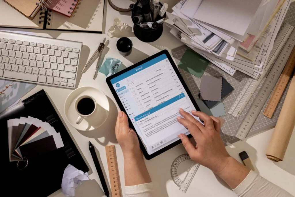 man checking invoice on his tablet